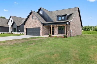 Welcome to this charming cottage-style new construction in the - photo 4