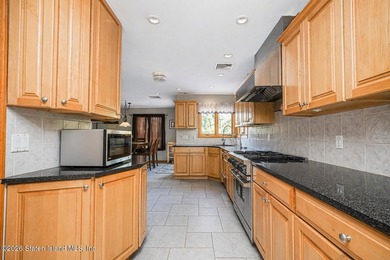 Welcome to this stunning 2-family colonial tucked away on a - photo 15