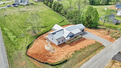 Quality new construction on a beautiful 1.7-acre corner lot! - photo 1
