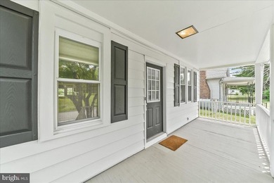 This charming bungalow offers a perfect blend of comfort and - photo 4