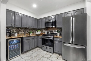 Welcome to this well-maintained three-family home in the Bronx - photo 5