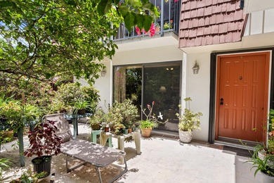 Nestled in a beautiful garden setting overlooking the lake & - photo 1