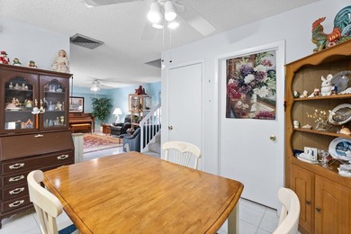 Nestled in a beautiful garden setting overlooking the lake & - photo 8