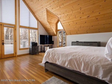 Nestled within Teton Pines, this exceptional Cluster Home offers - photo 12