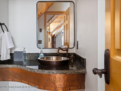 Nestled within Teton Pines, this exceptional Cluster Home offers - photo 14