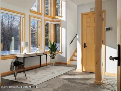Nestled within Teton Pines, this exceptional Cluster Home offers - photo 17