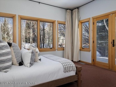 Nestled within Teton Pines, this exceptional Cluster Home offers - photo 20