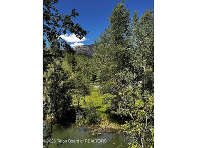 Nestled within Teton Pines, this exceptional Cluster Home offers - photo 24
