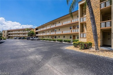 This Gulf Access Condo is located in a beautiful setting - photo 1