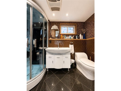 Detached multi-family home with a private driveway, offering the - photo 22