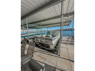 Welcome to your dream lakefront retreat in the Lake of the