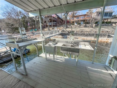 Welcome to your dream lakefront retreat in the Lake of the