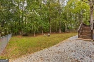 Nestled on a level lot just over half an acre, this beautifully - photo 35