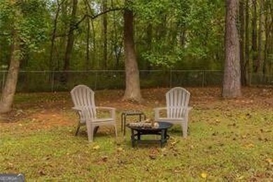 Nestled on a level lot just over half an acre, this beautifully - photo 36