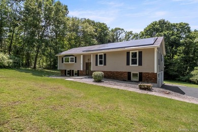 Tucked away on a beautifully wooded and private lot, this - photo 2