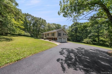 Tucked away on a beautifully wooded and private lot, this - photo 3