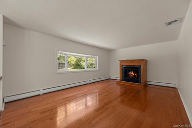 Tucked away on a beautifully wooded and private lot, this - photo 4