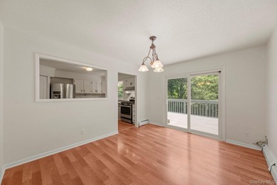 Tucked away on a beautifully wooded and private lot, this - photo 7