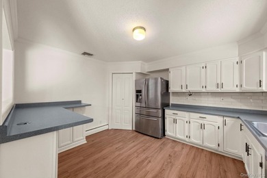Tucked away on a beautifully wooded and private lot, this - photo 9