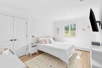 Nestled along the waterfront in East Quogue, 50 Sunset Avenue - photo 15