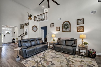 Drive your golf cart to the lake from this beautiful 3Br, 2 1/2