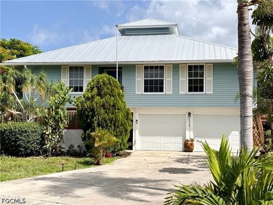 Elevated two Story piling home with over 1,700 sq ft under air - photo 1