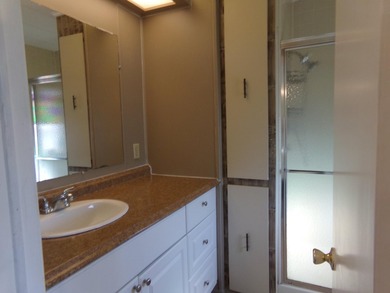 Welcome to this charming 3-bedroom, 2-bathroom manufactured home - photo 19