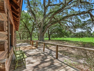 Tucked away behind a beautiful board-fenced entrance and paved - photo 11