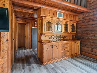 Tucked away behind a beautiful board-fenced entrance and paved - photo 17