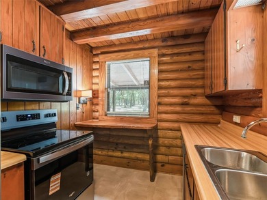 Tucked away behind a beautiful board-fenced entrance and paved - photo 20