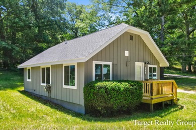 Enjoy views of Bostwick Lake from this completely updated home - photo 1