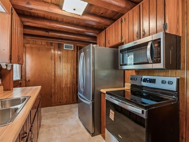 Tucked away behind a beautiful board-fenced entrance and paved - photo 21