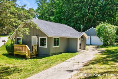Enjoy views of Bostwick Lake from this completely updated home - photo 2