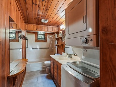 Tucked away behind a beautiful board-fenced entrance and paved - photo 22