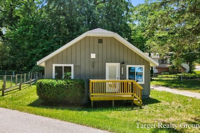 Enjoy views of Bostwick Lake from this completely updated home - photo 3