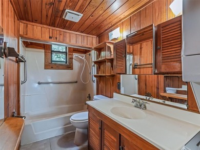 Tucked away behind a beautiful board-fenced entrance and paved - photo 23