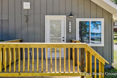 Enjoy views of Bostwick Lake from this completely updated home - photo 4