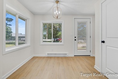 Enjoy views of Bostwick Lake from this completely updated home - photo 6