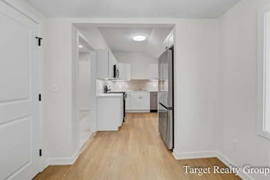 Enjoy views of Bostwick Lake from this completely updated home - photo 7