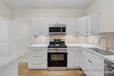 Enjoy views of Bostwick Lake from this completely updated home - photo 8