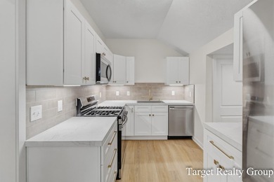 Enjoy views of Bostwick Lake from this completely updated home - photo 9