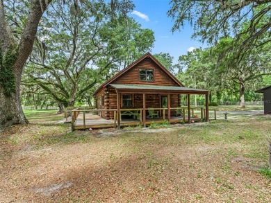 Tucked away behind a beautiful board-fenced entrance and paved - photo 34