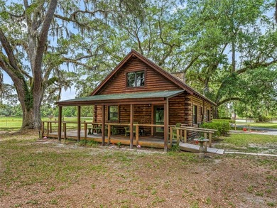 Tucked away behind a beautiful board-fenced entrance and paved - photo 35