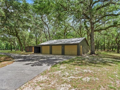 Tucked away behind a beautiful board-fenced entrance and paved - photo 36