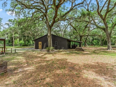 Tucked away behind a beautiful board-fenced entrance and paved - photo 37