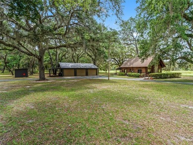 Tucked away behind a beautiful board-fenced entrance and paved - photo 39