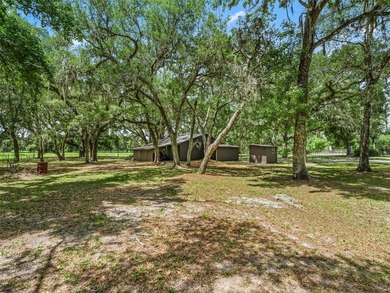 Tucked away behind a beautiful board-fenced entrance and paved - photo 41
