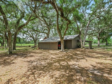 Tucked away behind a beautiful board-fenced entrance and paved - photo 42