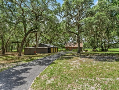 Tucked away behind a beautiful board-fenced entrance and paved - photo 43