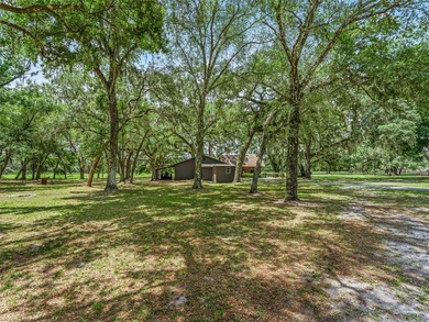 Tucked away behind a beautiful board-fenced entrance and paved - photo 44